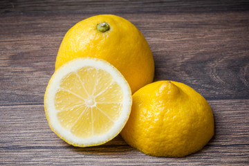 Lemon cut on wooden table.