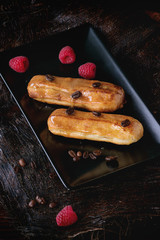Coffe eclair with raspberries