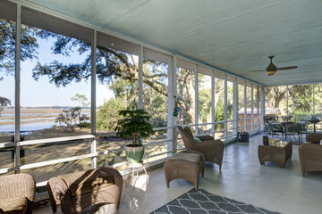 Screen porch with waterfront view