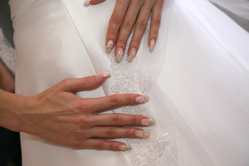 the bride shows her manicured hand