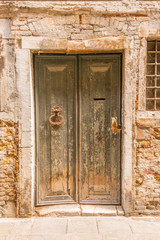 Entrance of an apartment building in Burano, Venice, Italy.