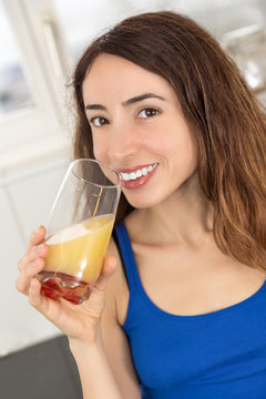 Woman drinking her grapefruit juice