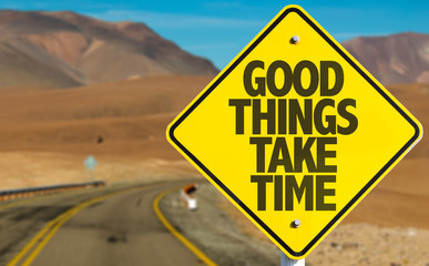 Good Things Take Time sign on desert road