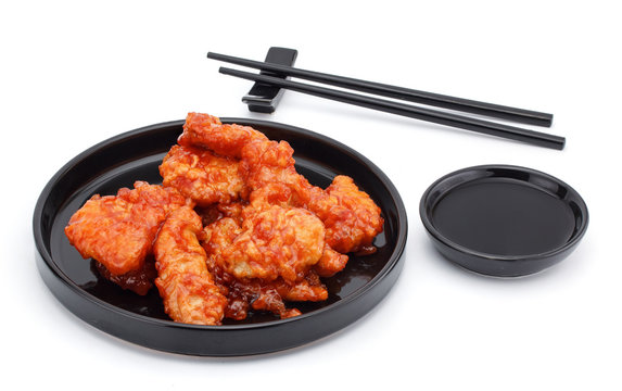 Sweet And Sour Chicken With Chopsticks And Soy Sauce Isolated On White Background