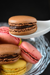 Person taking a macaron
