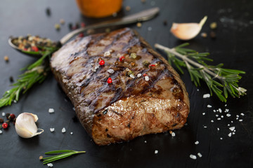 Grilled beef steak with aromatic spices and herbs