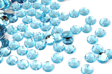 Blue rhinestone on white background