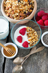healthy snack - granola on wooden surface