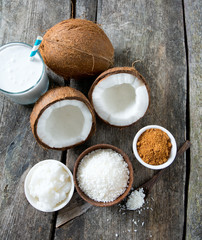 Fototapeta na wymiar coconut sugar, milk and oil on wooden surface