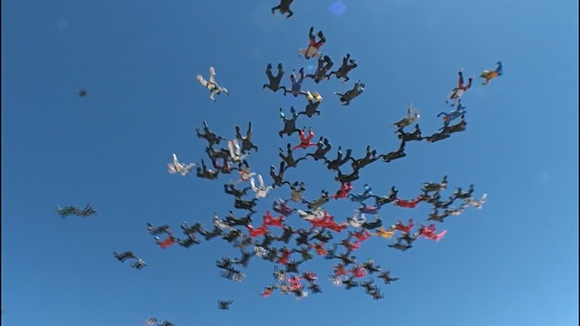 Skydiving big group formation, low angle view