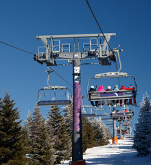 Ski chair lift with skiers