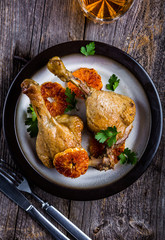 Roasted duck legs cooked in mandarins