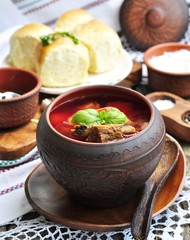 Ukrainian soup from vegetables Borsch on a wooden table.