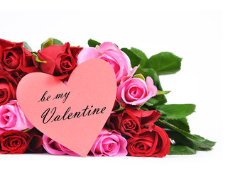 Red and pink roses with heart shaped Valentine's card