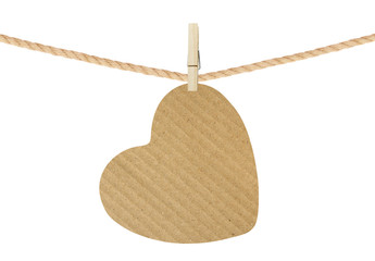 cardboard heart hang on clothespin isolated on white background