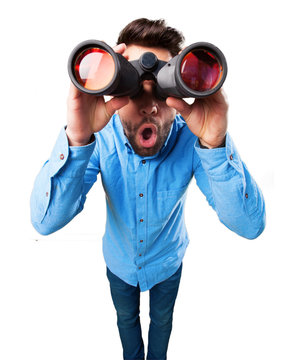 young man using binoculars