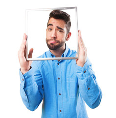 contradictory man holding a frame
