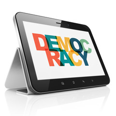 Political concept: Tablet Computer with Democracy on  display