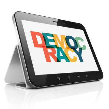 Political concept: Tablet Computer with Democracy on  display