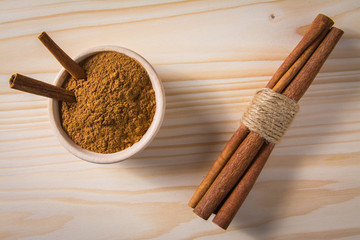 cinnamon in wooden bowl
