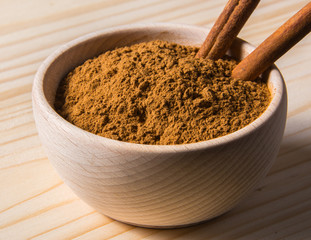 cinnamon in wooden bowl