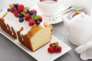 Yogurt pound cake with glaze and fresh berries