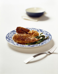 Roasted Chicken dinner with asparagus  served on plate