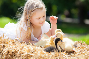 little girl with a duckling