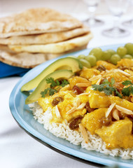 Curry Chicken with raisons and almonds on white rice.