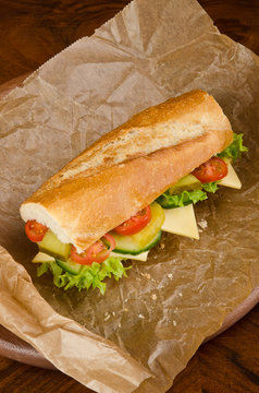 baguette with lettuce and cheese cucumber and tomatoes, sandwich