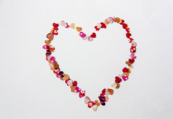 Obraz premium Heart frame of small love hearts on white background