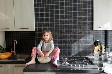Child playing with dough