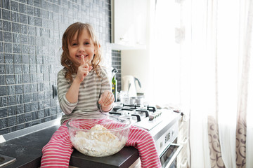 Child playing with dough
