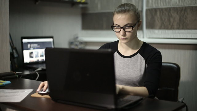 Young business ladies working behind the laptop at night
