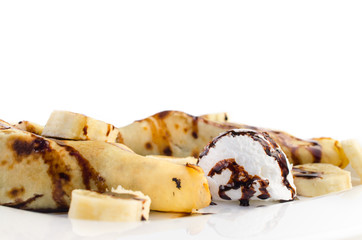 Pancakes with ice cream and banana slices
