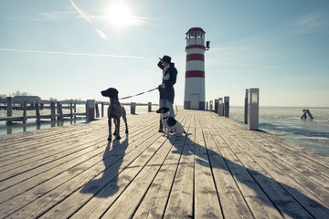 Fashionable woman posing with dogs outdoor