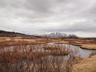 Little lake somewhere in iceland, in the background some snowy mountains.
Photo taken on: May...