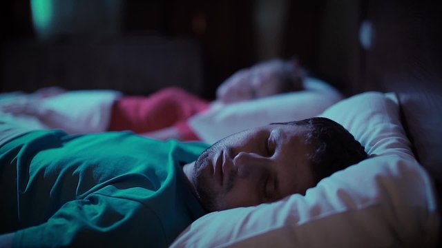 Snoring man. Couple in bed