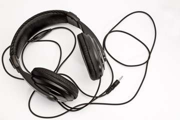 Black headphones on white background 