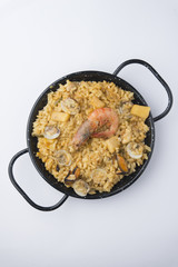traditional spanish rice - paella isolated on white background