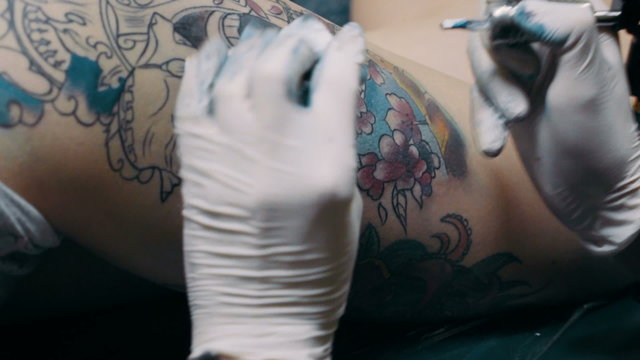 Tattoo artist make tattoo at the studio,close up