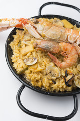 traditional spanish rice - paella isolated on white background