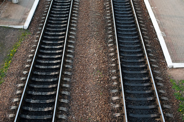 Fototapeta premium railroad tracks with railroad switch two paths come together