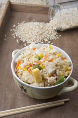 Rice with vegetables on white background