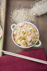 Rice with vegetables on white background