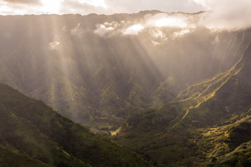 Sunlight beam through the clouds in the valley