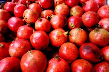 Red pomegranates in bulk at an Asian market