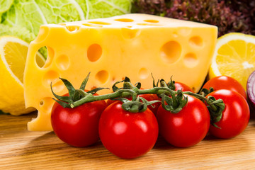 yellow cheese with fresh vegetables