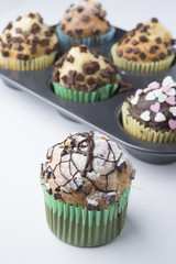 Chocolate Muffins with Sugar Icing. Isolated with clipping path.
