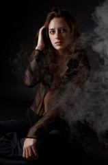 Woman Against Black Background With Smoke